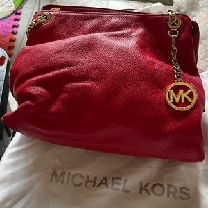 Red/Rouge colored Michael Kors purse